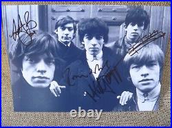 THE ROLLING STONES BAND SIGNED 8X11 PHOTO. Certified. Numbered. 