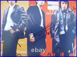 THE ROLLING STONES BAND SIGNED 8X11 PHOTO. Certified. Numbered. GENUINE