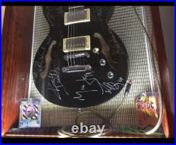 The Rolling Stones & ACDC hand signed guitar with COA The Rolling Stones & ACDC hand signed guitar with COA