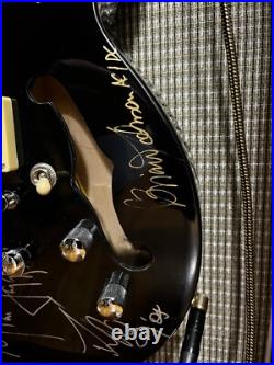 The Rolling Stones & ACDC hand signed guitar with COA The Rolling Stones & ACDC hand signed guitar with COA