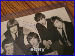 The Rolling Stones signed 1963 U. K. Souvenir photo by Brian Jones twice + Keith