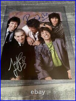 The Rolling Stones signed magazine page with COA 5 signatures